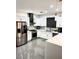 Bright modern kitchen with stainless steel appliances, white cabinetry, and stylish backsplash at 1525 Spiced Wine Ave # 14101, Henderson, NV 89074