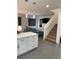 Open-concept living area with modern finishes and wood floors at 1525 Spiced Wine Ave # 14101, Henderson, NV 89074