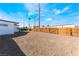 Large backyard features a wooden fence, offering privacy and security for outdoor activities and relaxation at 2 Utah Way, Henderson, NV 89015