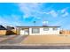Charming single-story home features a desert landscape, covered carport, and a freshly painted exterior at 2 Utah Way, Henderson, NV 89015