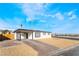 Charming single-story home with modern black and white design, inviting covered porch, and well-kept landscaping at 2 Utah Way, Henderson, NV 89015