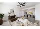 Bright living room with stylish furnishings, modern ceiling fan, and an open concept design at 2 Utah Way, Henderson, NV 89015