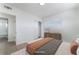 Serene main bedroom boasts natural light, minimalist decor, and hardwood floors at 2 Utah Way, Henderson, NV 89015