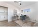 Bright office with a ceiling fan, hardwood floors, minimalist desk and chair, and a decorative rug at 2 Utah Way, Henderson, NV 89015