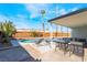 Backyard pool with stylish lounge chairs and covered patio is perfect for outdoor relaxing and entertaining at 2 Utah Way, Henderson, NV 89015