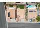 Aerial view of the property with a backyard, desert landscaping, and a two-car garage at 218 Red Coral Dr, Henderson, NV 89002