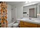 Bathroom featuring a shower-tub combination, toilet, and wood vanity with sink at 218 Red Coral Dr, Henderson, NV 89002
