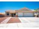 Inviting single-story home with a two-car garage, desert landscaping, and well maintained driveway at 218 Red Coral Dr, Henderson, NV 89002