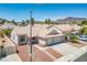 Inviting single-Gathering home featuring a two-car garage, desert landscaping and tile roof at 218 Red Coral Dr, Henderson, NV 89002