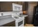 Clean kitchen featuring stainless steel appliances, ample counter space, and dark cabinetry at 218 Red Coral Dr, Henderson, NV 89002