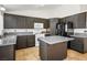 Modern kitchen with dark cabinets, functional island, and plenty of counter space at 218 Red Coral Dr, Henderson, NV 89002