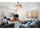 Inviting living room with vaulted ceilings, ceiling fan, and lots of natural light at 218 Red Coral Dr, Henderson, NV 89002