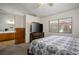 The primary bedroom features carpet flooring, a television, and ensuite bathroom, offering comfortable space at 218 Red Coral Dr, Henderson, NV 89002