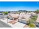 Neighborhood street view showcases a home with a two-car garage and a desert landscape at 218 Red Coral Dr, Henderson, NV 89002
