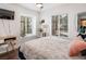 Cozy bedroom with light colored walls, natural light from two windows and hardwood floors at 2200 S Fort Apache Rd # 2217, Las Vegas, NV 89117