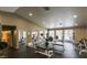 Community gym with weightlifting equipment, mirrors, rubber flooring, and multiple windows at 2200 S Fort Apache Rd # 2217, Las Vegas, NV 89117