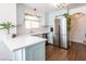 Modern kitchen features sleek countertops, stainless steel appliances, and stylish blue cabinetry for a contemporary look at 2200 S Fort Apache Rd # 2217, Las Vegas, NV 89117