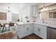 Well-lit kitchen showcasing modern appliances, blue cabinets, and adjacent dining area for easy meal service at 2200 S Fort Apache Rd # 2217, Las Vegas, NV 89117