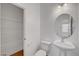 Well-lit bathroom with a single sink and tile flooring near shelving at 2261 Dalton Ridge Ct, North Las Vegas, NV 89031