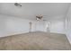 Spacious carpeted bedroom featuring a ceiling fan and white walls at 2261 Dalton Ridge Ct, North Las Vegas, NV 89031