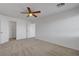 Bedroom with neutral carpet, ceiling fan, and closet access at 2261 Dalton Ridge Ct, North Las Vegas, NV 89031
