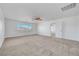 Large bedroom with a ceiling fan, neutral carpet, and natural light at 2261 Dalton Ridge Ct, North Las Vegas, NV 89031