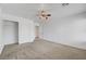 Bedroom with neutral carpet, ceiling fan, and closet access at 2261 Dalton Ridge Ct, North Las Vegas, NV 89031
