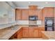 Modern kitchen with granite countertops, stainless steel appliances, and ample cabinet space at 2261 Dalton Ridge Ct, North Las Vegas, NV 89031