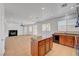 Open kitchen and living area, featuring a center island and fireplace at 2261 Dalton Ridge Ct, North Las Vegas, NV 89031
