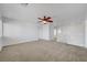 Spacious living room with ceiling fan and view of the staircase at 2261 Dalton Ridge Ct, North Las Vegas, NV 89031