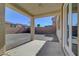 Covered patio overlooking the spacious backyard and desert landscape at 2261 Dalton Ridge Ct, North Las Vegas, NV 89031