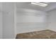 Walk-in closet with shelving and neutral carpeting at 2261 Dalton Ridge Ct, North Las Vegas, NV 89031