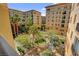 Exterior view of Boca Raton Residences showcasing a landscaped courtyard at 2405 W Serene Ave # 612, Las Vegas, NV 89123