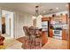 Kitchen island with seating, offering a peek into the bedroom and a well-equipped cooking space at 2405 W Serene Ave # 612, Las Vegas, NV 89123