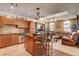 Open kitchen with island seating, stainless steel appliances, and a seamless flow to the living room at 2405 W Serene Ave # 612, Las Vegas, NV 89123
