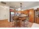 Well-lit kitchen island with seating, stainless steel appliances, and ample cabinet space at 2405 W Serene Ave # 612, Las Vegas, NV 89123