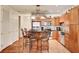 Bright kitchen with stainless steel appliances, island seating, and access to a pantry and the entry door at 2405 W Serene Ave # 612, Las Vegas, NV 89123