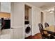 Laundry closet and dining area with bar and chairs at 2405 W Serene Ave # 612, Las Vegas, NV 89123