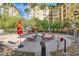 Relaxing pool area with lounge chairs, umbrellas, and a water feature, offering a serene outdoor experience at 2405 W Serene Ave # 612, Las Vegas, NV 89123