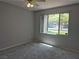 Bedroom with gray walls and carpets and a window with a view of the parking lot at 2900 Sunridge Heights Pkwy # 418, Henderson, NV 89052
