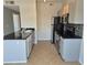Well-lit kitchen features granite countertops, stainless appliances, and tile flooring at 2900 Sunridge Heights Pkwy # 418, Henderson, NV 89052