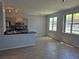 Open concept kitchen and living room with tile floors and updated appliances at 2900 Sunridge Heights Pkwy # 418, Henderson, NV 89052