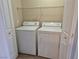 Convenient laundry closet features full-size washer and dryer units and shelving at 2900 Sunridge Heights Pkwy # 418, Henderson, NV 89052