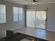 Spacious living room with tile flooring, fan, and access to outdoor balcony at 2900 Sunridge Heights Pkwy # 418, Henderson, NV 89052