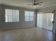 Bright living room with tile flooring, ceiling fan, and sliding glass doors at 2900 Sunridge Heights Pkwy # 418, Henderson, NV 89052