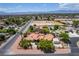 Expansive aerial view of a single-story home featuring mature landscaping, a terracotta roof, and a spacious lot in a suburban neighborhood at 3085 Duneville St, Las Vegas, NV 89146