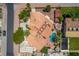 Stunning aerial view of a property with a pool, mature landscaping, and a tile roof at 3085 Duneville St, Las Vegas, NV 89146