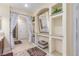 Bright bathroom featuring built-in shelving, a large mirror, and decorative curtains at 3085 Duneville St, Las Vegas, NV 89146