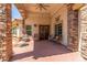 Inviting covered front porch with stone accents, outdoor seating, and double door entry at 3085 Duneville St, Las Vegas, NV 89146