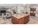 Expansive kitchen island with bar seating, and an open floor plan to the dining and living areas at 3085 Duneville St, Las Vegas, NV 89146